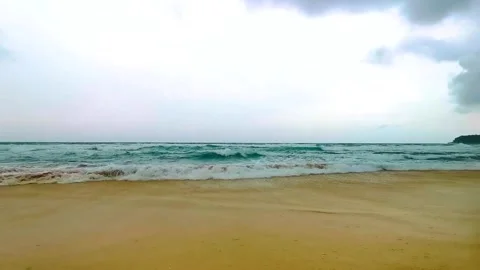 Powerful monsoon rain clouds above tropical beach with turquoise waves Kata.. Stock-Footage 346136251
