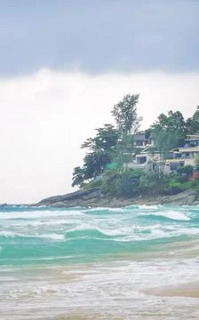 Powerful monsoon rain clouds above tropical beach turquoise waves rainfores.. Stock Photos