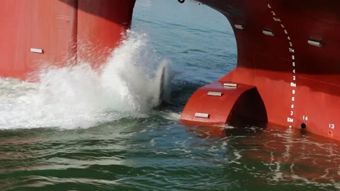 The Powerful Motion Of Water Being Displaced By A Large, Red Ship’s Propeller Stock Footage 266415724
