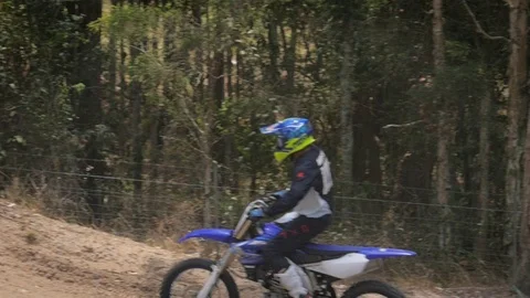 Powerful Motocross Bike With Exploding Dirt And Stones, Slomo Stock Footage 122968338