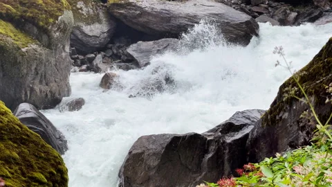 Powerful mountain river slow mo running through the big boulders down foggy rain Stock-Footage 285777419