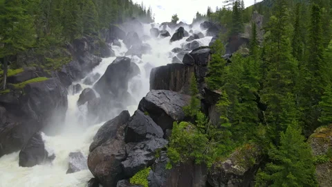 A powerful mountain waterfall in the forest Stock Footage 244652036