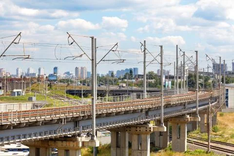 A powerful multi-level railway network with a bend and a flyover against the  Stock Photos