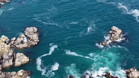 This powerful natural image shows the rugged rocky coast of the Pointe du Van in Stock Footage 336341224