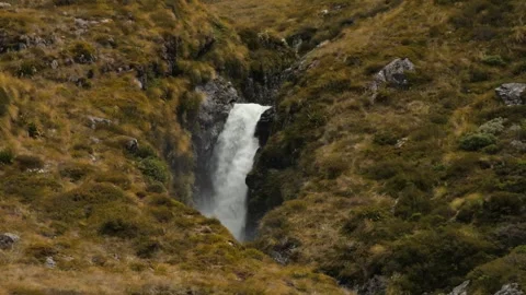 Powerful Natural Spring Flowing from the Heart of a Green Mountain Stock Footage 315099778