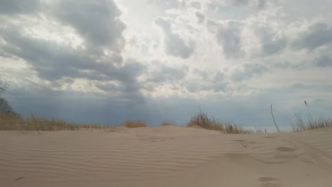 Powerful natural visuals depicting thunderstorms over open fields and dunes 스톡 동영상 334012438