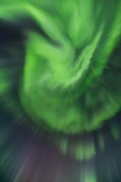 Powerful northern lights explode across the sky during an auroral substorm Stock Photos