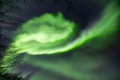 Powerful northern lights explode across the sky during an auroral substorm Stock Photos