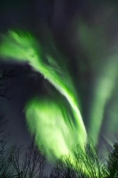 Powerful northern lights explode across the sky during an auroral substorm Stock Photos