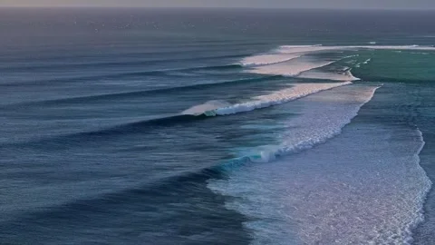Powerful ocean swells rolling and breaking into long lines of white foam waves Stock Footage 340118480