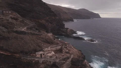 Powerful ocean waves breaking against volcanic rocky coastline near coastline 스톡 동영상 308419980
