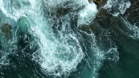 Powerful ocean waves clash against the rocky shore. Stock Footage 308608906