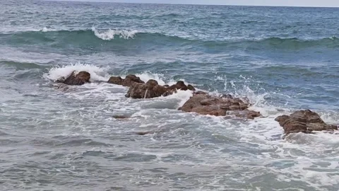 Powerful Ocean Waves Crashing Against Rocky Shoreline Video stock 333606846
