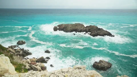 Powerful Ocean Waves Crashing Against Rocky Island Stock Footage 341147696