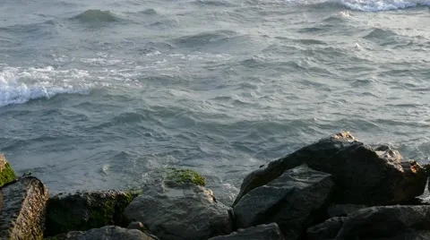Powerful ocean waves crashing on the rocks in the sunset light Stock Footage 51144865