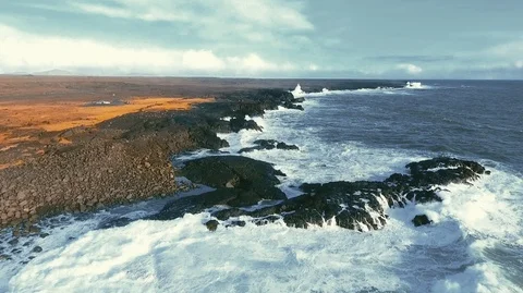 Powerful ocean waves crashing on the rocks in the western part of Iceland in the Stock Footage 120000628
