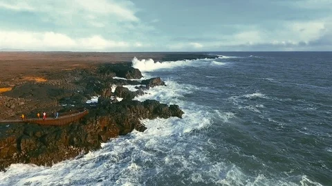 Powerful ocean waves crashing on the rocks in the western part of Iceland in the Stock Footage 120000786