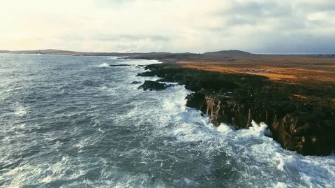 Powerful ocean waves crashing on the rocks in the western part of Iceland in the Stock Footage 120000896