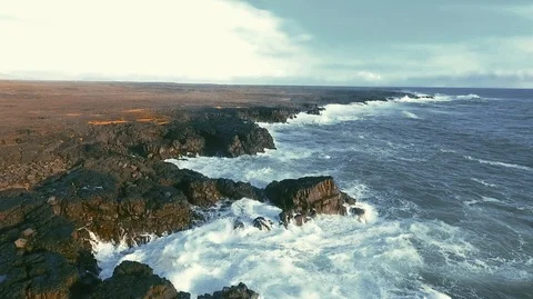Powerful ocean waves crashing on the rocks in the western part of Iceland in the Stock Footage 120001074