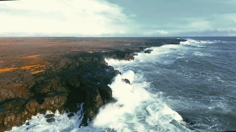 Powerful ocean waves crashing on the rocks in the western part of Iceland in the Stock Footage 120001096