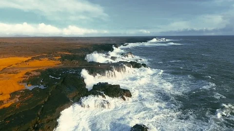 Powerful ocean waves crashing on the rocks in the western part of Iceland in the Stock Footage 120001225