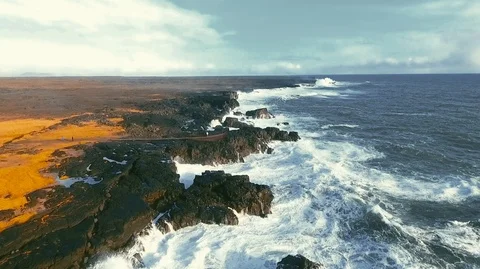 Powerful ocean waves crashing on the rocks in the western part of Iceland in the Stock Footage 120001302