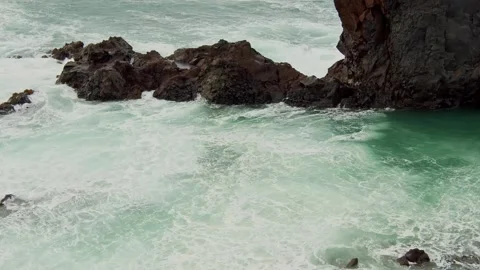 Powerful Ocean Waves Crashing on a Rocky Coastline Stock Footage 320229334