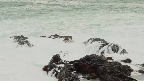 Powerful Ocean Waves Crashing on a Rugged, Rocky Coastline Stock Footage 320229163