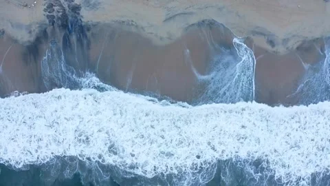 Powerful Ocean Waves Crashing on Sandy Beach Aerial Top Down View Stock Footage 319894575