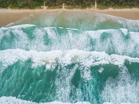 Powerful ocean waves crushing on sandy beach Stock Photos