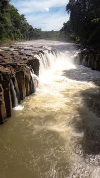 Powerful Pha Suam Waterfall Cascading Over Basalt Rocks in Lush Laos Stock Photos
