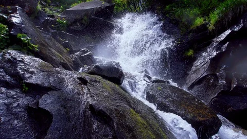Powerful raging Mountain waterfall. Clear water stream dropping crashing and Stock Footage 94744005