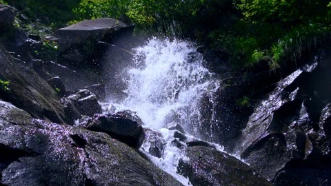 Powerful raging Mountain waterfall. Clear water stream dropping crashing and Stock Footage 94744045