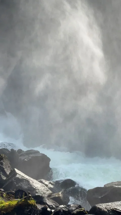Powerful raging waterfall creating mist and spray Video stock 324598762