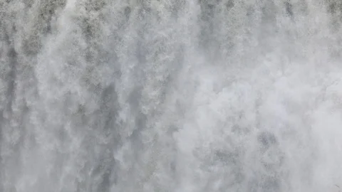 Powerful raging whitewater waterfall falling forcefully over a rocky 스톡 동영상 96252328