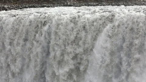 Powerful raging whitewater waterfall falling forcefully over a rocky Stock Footage 96252440