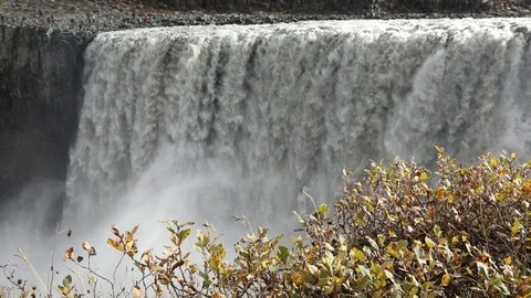 Powerful raging whitewater waterfall falling forcefully over a rocky Vidéo 96252593