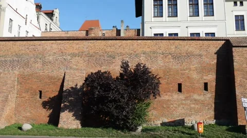 A powerful red brick wall around the old city. Torun is city on Vistula Riv.. Stock Footage 238087039