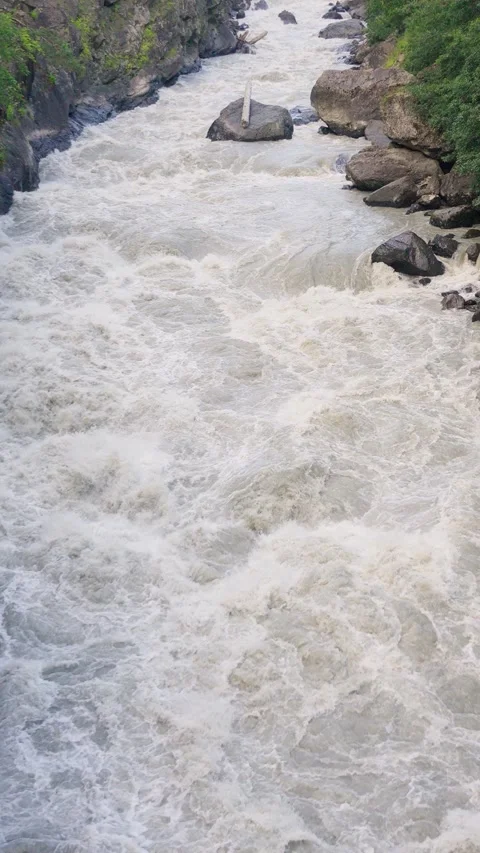 Powerful river flowing through a mountain gorge Stock Footage 288499245