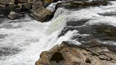 Powerful River Rapids Cascading Over Rocks in Natural Landscape Stock Photos