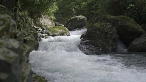 Powerful river rapids gushing over rocks in slow motion Stock-Footage 72504559