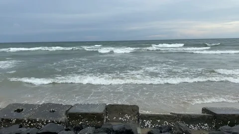 Powerful sea waves hitting rocks on the beach Video stock 164237927