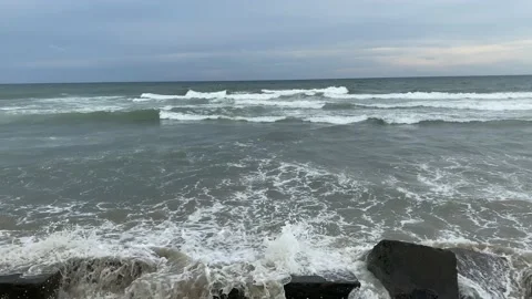 Powerful sea waves hitting rocks on the beach Video stock 164237969