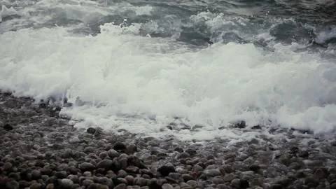 Powerful sea waves roll over the pebbly seashore. Stock Footage 165201574