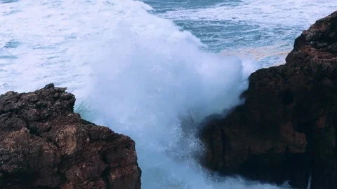 Powerful Slow Motion Ocean Waves Crashing Through Rocky Cliffs Stock Footage 296696603