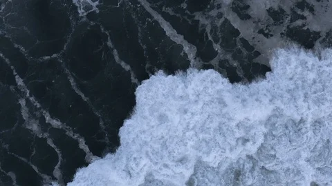 Powerful slow-motion wave crashes after storm, top-down aerial Stock Footage 112705226