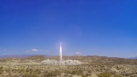A powerful space launch vehicle ascending rapidly into the clear blue sky. Stock Footage 327342228