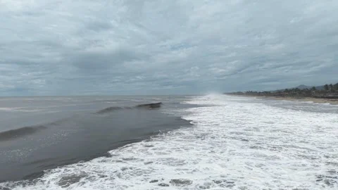 Powerful storm waves breaking on the Pacific near Acapulco, aerial drone footage 動画素材 348254151