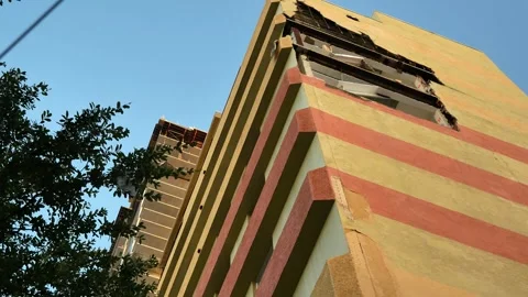 Powerful storms caused a large section of wall stairwell blown off and exposed b Stock Footage 289159644