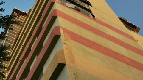 Powerful storms caused a large section of wall stairwell blown off and exposed b Stock Footage 289159722